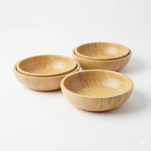 Set of three wooden bowls on a white background